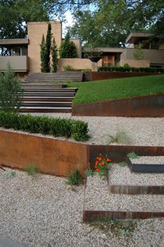 an outdoor garden with metal steps and plants