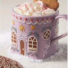 a purple cup filled with whipped cream and cookies