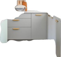 an image of a modern bathroom vanity with gold handles and knobs on the drawers