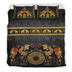 an elephant bedding set with gold and black designs