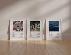 three framed photographs sitting on top of a wooden floor