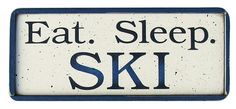 a sign that says eat sleep ski in black and white letters on the bottom of it