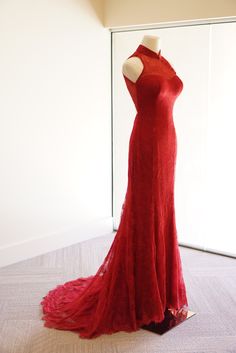 a red dress on display in a room