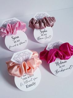 four different types of hair scrunffles with names on them