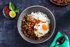 a bowl filled with rice and an egg on top