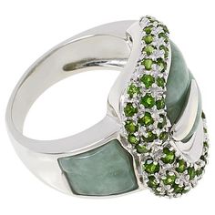 Jade of Yesteryear Jade and Gemstone Sterling Silver Buckle Ring This statement ring takes the classic buckle design and gives it a vibrant, gem-forward twist that will have heads turning.       Approx. 13/16"L x 7/8"W x 5/16"H; shank 1/8"W     Stamped .925 sterling silver; rhodium plating   Stone Information       All sizes and weights approximate     Green Jade - Geometric (15x10mm, 8x7mm)     Chrome Diopside - Round; 0.90ctw     Color-Enhanced Polymer Impregnated Purple Jade - Geometric (15x1 Fine Jewelry Rings With Stones For Formal Occasions, Formal Fine Jewelry Rings With Stones, Fine Jewelry Peridot For Formal Occasion, Formal Rings With Round Gemstone Accents, Formal Fine Jewelry With Peridot, Luxury Peridot Multi-stone Jewelry, Luxury Peridot Jewelry With Accent Stones, Luxury Multi-stone Peridot Jewelry, Formal Jewelry With Round Gemstone Accents