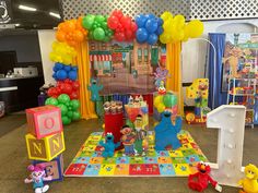 sesame street birthday party with balloons and toys