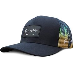 a blue hat with an embroidered patch on the front and side, featuring palm trees