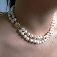 "Why wear one string when you can wear two?" Coco Chanel. You can never go wrong with a classic double strands of pearls!Large White ( some light pink and peach overtone) Round, high-luster with typical natural blemishes Japanese Cultured pearls are double-knotted in this unforgettable piece, finished with a striking 14K Yellow gold clasp.Each pearl measures approx. 7.5mm in average with a total strands length of 16" and 17 inches. The weight 61.40gm.The 14k Yellow Gold ( stamped), Open Filigree Luxury Hand-strung Pearl Necklace With Round Beads, Luxury Gold Double Strand Beaded Necklace, Classic Double Strand Pearl White Necklace, Pearl White Double Strand Akoya Pearl Necklace, Double Strand Akoya Pearl Necklace In Pearl White, Pearl White Akoya Pearl Double Strand Necklace, Japanese Pearls, Chanel Pearls, Double Strand Necklace