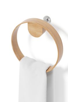 a wooden towel ring hanging on the wall