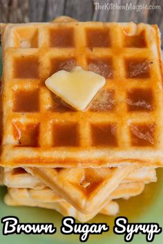 three waffles stacked on top of each other with butter and syrup in the middle