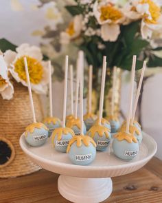 cake pops with caramel drizzled on them sitting on a white plate