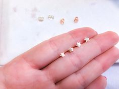 Tiny stars stud earrings 925 Sterling Silver | Rose gold small stars ear studs | Valentine's Day gift | Dainty stars small earrings. Perfect earrings to wear everyday or for your second ear piercings. Those earrings are perfect for sensitive ears, are 925 Sterling Silver, hypoallergenic and nickel free. 925 stamped. Metal : 925 Sterling Silver ( Rose gold plated ). Weight : 0,35g. Measurements : 4mm x 4mm. All our items are ship in a organza bag inside of a waterproof bubble envelope. Free and r Minimalist Star-shaped Hypoallergenic Cartilage Earrings, Minimalist Hypoallergenic Star Cartilage Earrings, Minimalist Hypoallergenic Star Piercings, Dainty Star Charm Piercings For Gifts, Dainty Star-shaped Piercings As Gift, Nickel-free Star-shaped Cartilage Earrings As Gift, Nickel-free Star-shaped Cartilage Earrings For Gifts, Nickel-free Star Cartilage Earrings As Gift, Tiny Star-shaped Piercings For Gift