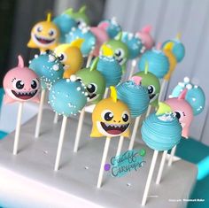 there are many cake pops with different designs on them