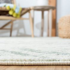 an area rug on the floor in a living room