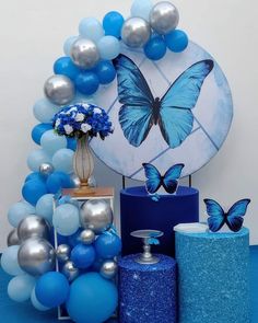 blue and silver decorations with a butterfly on it