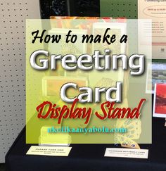 a display table with greeting cards on it and the words how to make a greeting card display stand