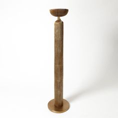 a tall wooden object on a white background