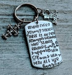 a keychain with the words behind every strong soldier there is an angel who stands behind him