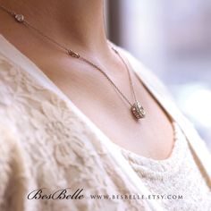 Only pendant necklace: https://www.etsy.com/listing/243617126/120-cttw-classic-halo-pendant-necklace?ref=shop_home_active_10 Matching earrings: https://www.etsy.com/listing/247600444/109-cttw-round-halo-stud-earrings?ref=shop_home_active_1 Our diamond simulants are elegant, unique, and outstanding. The gemstones are cultured from the Czech Republic and handmade at our studios in Garment District and Diamond District in New York City, U.S. They are finished through supremacy cuttings and brillian Timeless Sterling Silver Jewelry For Anniversary, Timeless Sterling Silver Diamond Necklace For Wedding, Elegant Sterling Silver Engraved Diamond Necklace, Elegant Engraved Sterling Silver Diamond Necklace, Delicate Engraved White Gold Jewelry, Silver Engraved Diamond Necklace For Wedding, Fine Jewelry Wedding Necklace With Adjustable Chain, Sterling Silver Round Necklace For Wedding, Delicate Diamond Cut Sterling Silver Necklace