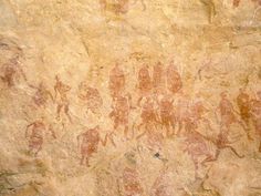 an image of some people and animals on a wall