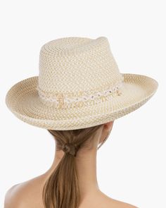 Tucson is a designer woman's sunhat for sale made of Squishee®. The modified Western shape has a fringe-edged band and a self-bolo braid chin strap with a wood bead to adjust and secure it. The signature logo rivet is discretely placed at the back of the crown. The wired brim permits shaping; push up the sides for more Western flare, or flatten them out for additional shade. Squishee® is a man-made material incorporating recycled fibers. It looks and feels just like natural raffia but has the ad Elegant Adjustable Braided Hat, Western Style Cream Panama Hat, Elegant Adjustable Woven Hat Bands, Adjustable Fringe Hats, Adjustable Woven Fedora For Kentucky Derby, Natural Woven Fedora, Adjustable Woven Fedora For Spring, Adjustable Braided Panama Hat For Spring, Casual Sun Hat With Fringe