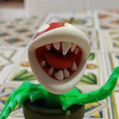 a close up of a toy with teeth and mouth