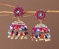 Our Indian earring is silver plated, created with careful attention to detail. The color combination and finishing give it an elegant look & feel. This design is perfect for parties & functions as these handcrafted earrings are specially designed for Indian beautiful brides -Base Metal- Alloy, Silver, Brass -Plating- Silver -Stone- Pearls, Beads & sequin -Sizing-Non Adjustable -Type- Jhumkas Earrings -Light Weight -Color- Multi -FREE Shipping -Gift Wrapping Available -Delivery from a Small Business in India -Handmade Product Skin Friendly- Lead & Nickel Free in compliance with all International Requirements. Gift - Ideal Valentine, Birthday, Anniversary gift for someone you Love/ Best Friend/Girlfriend. Occasion - Festivals, Wedding, Party Wear, Bridal, Perfect For Indian Weddings We Tried Rajasthani Jewellery, Jhumkas Earrings, Multicolor Earrings, Jewelry Safe, Indian Earrings, Oxidised Jewellery, Jhumka Earrings, Handcrafted Earrings, Pink Earrings