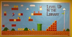 a bulletin board with the words level up in the library written on it and video game characters