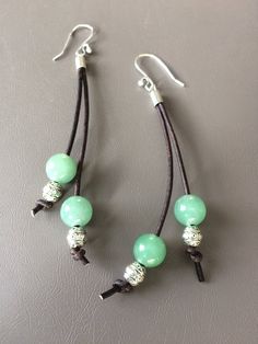 "These unique Green Aventurine earrings are just what you're looking for. Made with 8 mm Green Aventurine and 6mm silver tribal beads on natural dark brown leather cord. The earrings are 3 1/2\" in length and the ear wires are silver plated copper. These would go perfectly with this necklace. https://etsy.me/2JvqlSA" Aventurine Earrings, Acrylic Nails Almond Shape, Leather Cord Jewelry, Cord Jewelry, Almond Acrylic Nails, Almond Shape, Nails Almond, Jewelry Boho, Dark Brown Leather