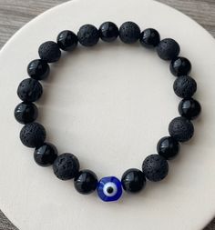 Beautiful classic evil eye bracelet made with black onyx and lava stone beads  Stay protected from negativity everywhere you go Good vibes only  bracelet can also double as diffuser bracelet just add your favorite essential oils and enjoy Evil Eye Beads Bracelet, Evil Eye Jewelry Bracelet, Evil Eye Stone, Evil Eye Beaded Bracelet, Lava Bead Bracelet, Evil Eye Beads, Bracelet Inspo, Bracelets Ideas, Black Beaded Bracelets