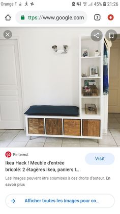 an image of a white shelf with drawers and baskets on it's sides, in the corner of a room