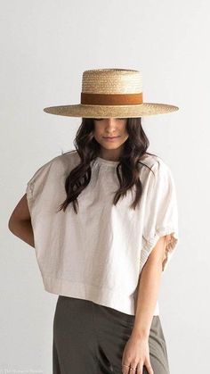 DESCRIPTION:The Capri is a classic boater style hat in natural dyed wheat straw with a stiff brim. The wide brim of the Capri Medium makes for a great sun hat to take to the beach or pool. The Capri features a camel suede band with our signature xx stitching on back. The suede band is sprayed with a weather protectant spray, but is not considered waterproof. Color: Natural Content: 100% Wheat Straw / Suede band / Cotton poly inner sweatband. 9.5 cm crown height and 11 cm brim width. Imported Please Note: Exact colors and patterns may vary slightly from the image(s) shown, due to differences in photographic lighting sources and, or monitor settings. ABOUT THE FIT: Fit: Made with an adjustable inner band to ensure the perfect fit! How to measure for fit: For hat sizing tips check out our hat Gigi Pip, Straw Boater Hat, Straw Boater, Wide Brim Straw Hat, Boho Hat, Sailor Hat, Boater Hat, Wheat Straw, Halo Style