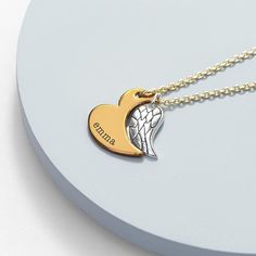 For a loved one in need of a stylish new necklace, you've come to the right place! Treat her today with our sensational personalised heart and wing necklace. It's sure to make an amazing birthday present or Valentine's Day gift for a deserving loved one who, like the necklace, brightens up every room she enters.  Personalise with your loved one's name for a truly one-of-a-kind gift for her that she's sure to love. Our dedicated team of artisan creatives will then meticulously engrave her name onto her necklace for her, creating a remarkable gift of the highest quality.   The chain and the cutout heart pendant will be the same colour as standard. Whilst for the silver chained necklace the wing will be a glorious gold and for the gold chained necklace the wing will be a stunning silver.   Na Personalized Wing-inspired Jewelry Gift, Unique Personalized Heart-shaped Necklace, Wing-shaped Necklace For Valentine's Day Gift, Heart-shaped Name Necklace As Personalized Gift, Chained Necklace, 14k Gold Heart-shaped Name Necklace For Personalized Gift, Personalized Wing-shaped Necklace For Gift, Personalized Wing-shaped Necklaces For Gifts, Elegant Heart-shaped Angel Wings Necklace