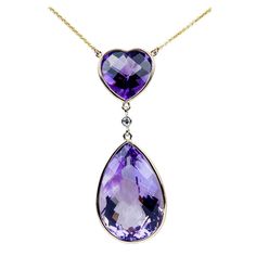 Simply Beautifully! Amethyst and Gold Vintage Pendant Necklace. Suspending a Heart and Teardrop facet Checkerboard-cut Amethyst Heart measuring approx. 15mm x 15mm and Teardrop Amethyst 28mm x 19mm. Centered by a round Brilliant-cut Diamond; weighing approx 0.07 Carat. Hand crafted 14k Yellow Gold mounting. Suspended from a 14k Yellow Gold chain. More Beautiful in Real time! Sure to be admired…A Piece you'll turn to time and again! Diamond Gold Pendant, Belle Epoch, Drop Necklaces, Diamond Drop Necklace, Teardrop Diamond, Vintage Pendant Necklace, Marquise Shape Diamond, Amethyst Heart, Coach House