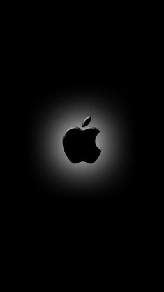 an apple logo is shown in the dark