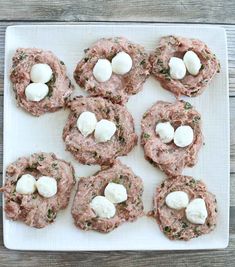 small appetizers with marshmallows are arranged on a white plate