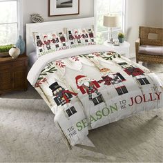 a bed with christmas decorations on it in a room next to a lamp and window