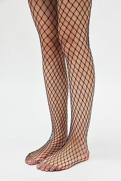 Forever favorite fishnet tights in a soft open-net finish. Features Fishnet tights Iconic netted tights Soft and stretchy Lightweight feel Content + Care 94% Nylon, 6% spandex Hand wash Imported Size + Fit S/M 4'10" -5'6" 90-130lbs L/XL 5'7" -5'6" 130-200lbs | Fishnet Tights in Black, Women's at Urban Outfitters Cheap High-waist Fitted Hosiery, Cheap Fitted Summer Tights, Cheap Casual Black Stockings, Plus Size Fishnet And Shorts, Cheap Sheer Women's Bottoms, Black Stocking With Sequin Shorts, Cheap Casual Black Hosiery, Pink Fishnets Top, Fish Net Bodysuit