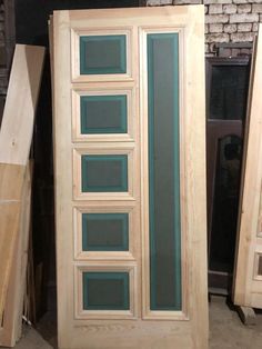 an unfinished door is shown in front of other pieces of wood