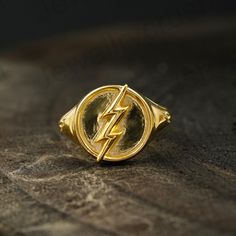 Flash Ring,Sterling Silver Ring,Flash Point Ring,DC Comics,DC Jewelry,14k Gold Ring,Unisex Ring,Stackable Ring,Barry Allen Ring,Cosplay Ring   S I L V E R J E W E L R Y C A R E Silver is not the best friend of oxygen and sulfur; it can be oxidized and tarnished from time to time it is the nature of silver. To keep the silver shiny and prevent it from oxidizing fast, we would recommend the following instructions; * Avoid any chemical agents including perfume, makeup, and hair spray. * Avoid weari Dc Jewelry, Flash Ring, Flash Point, Barry Allen, Fancy Gifts, Hair Spray, Unisex Ring, Stackable Ring, 14k Gold Ring