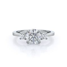 an engagement ring with three stone diamonds