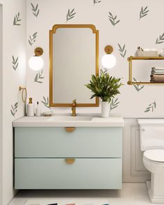 a bathroom with a mirror, sink and toilet