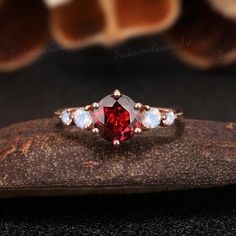 Unique Round Garnet Engagement Ring Set Vintage Moonstone - Etsy Elegant Three Stone Gemstones For Wedding, Elegant Three-stone Ruby Ring For Wedding, Elegant Red Three Stone Birthstone Ring, Elegant Red Three-stone Birthstone Ring, Round Wedding Gemstones With Accent Stones, Fine Jewelry Ruby Three Stone Ring For Wedding, Oval Red Crystal Ring For Wedding, Fine Jewelry Three Stone Ruby Ring For Wedding, Wedding Gemstones With Round Accent Stones