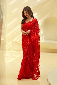 This ruby red net saree features all over three-dimensional floral hand embroidery.From Seema Gujral's Reverie collection DELIVERY TIMEPlease allow 8-12 weeks for your outfit to arrive. FABRIC DETAILSNet. Professional cleaning only. Red Floral Saree, Red Saree Wedding, Red Sari, Floral Saree, Indian Fashion Saree, Saree Designs Party Wear, Net Saree, Red Saree, Party Wear Indian Dresses