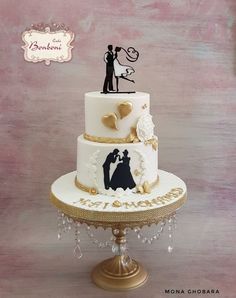 a wedding cake with the bride and groom on top