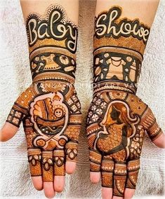 two hands with henna designs on them and the words baby shower written in arabic