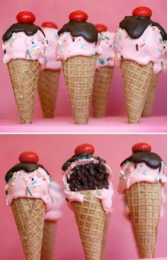 four ice cream cones with chocolate and sprinkles on them, each topped with a cherry