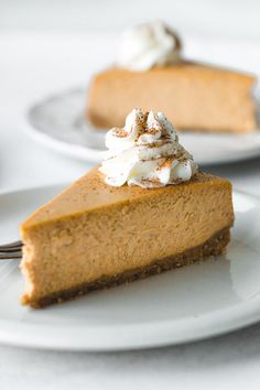 a slice of pumpkin pie with whipped cream on top