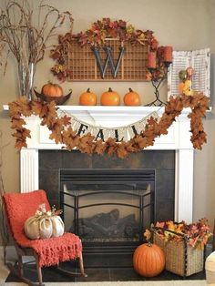 a fireplace decorated for fall with pumpkins, leaves and other decorations on the mantle